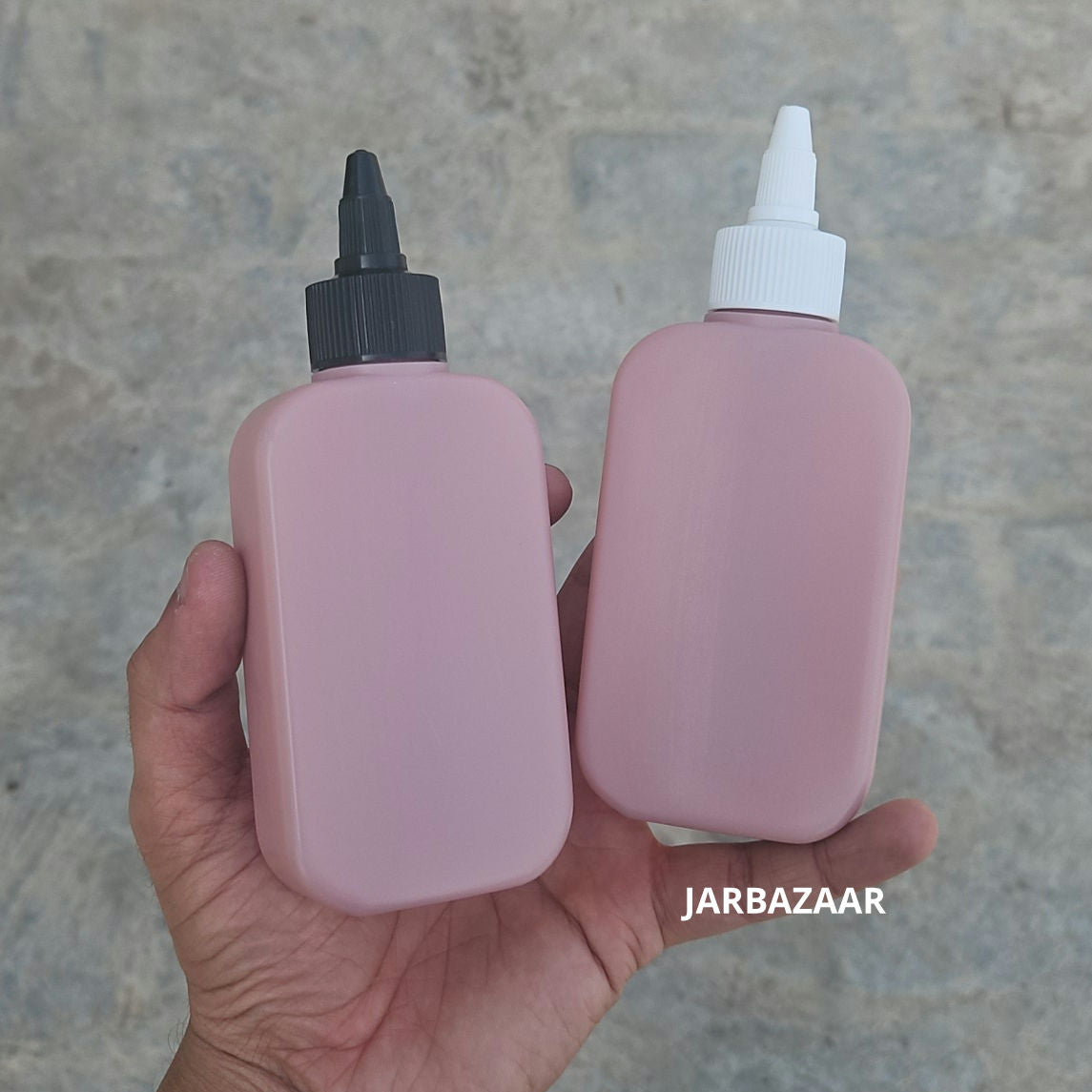 125 ML flat dark pink HDPE bottles with black and white nozzle caps