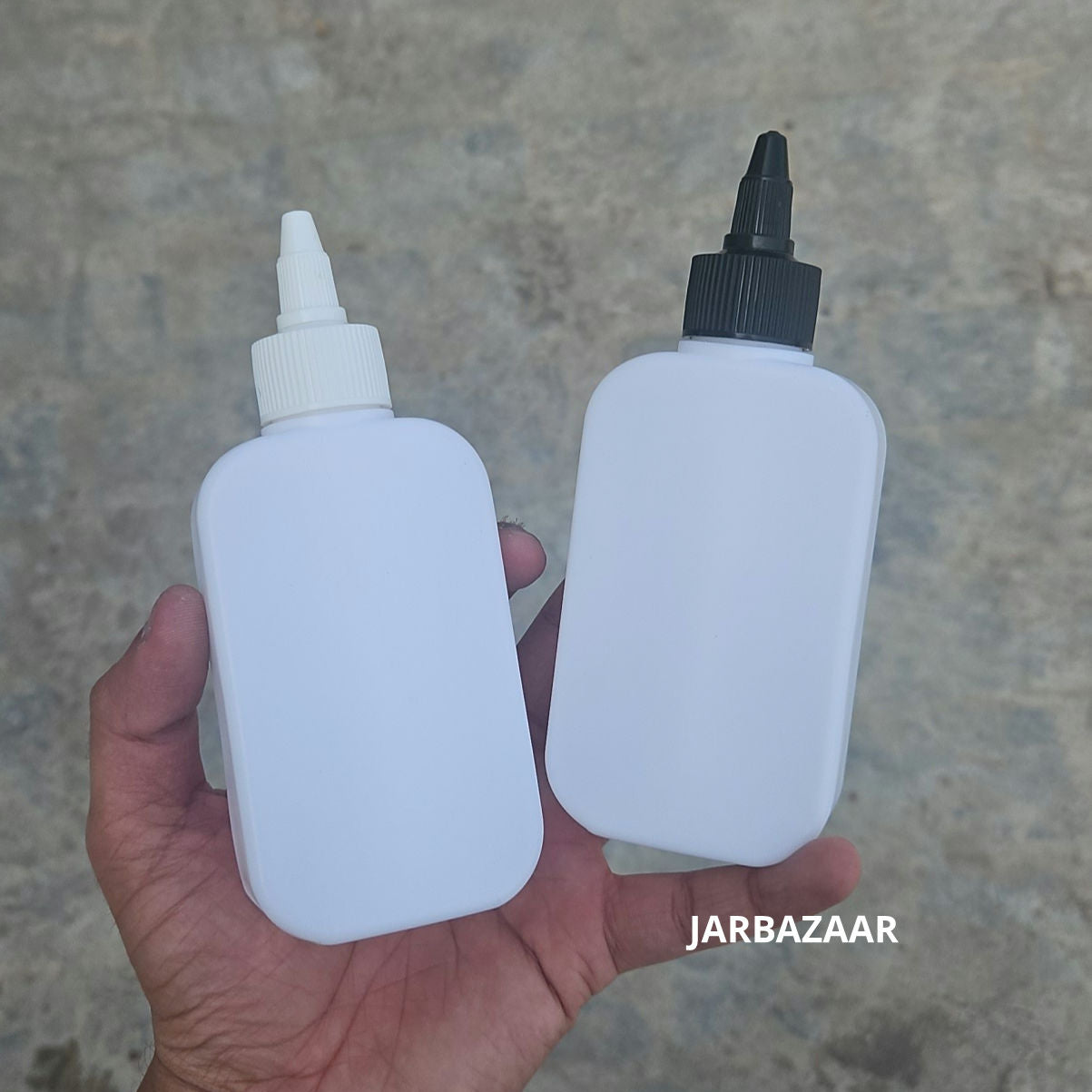 125 ML flat white HDPE bottles with black and white nozzle caps