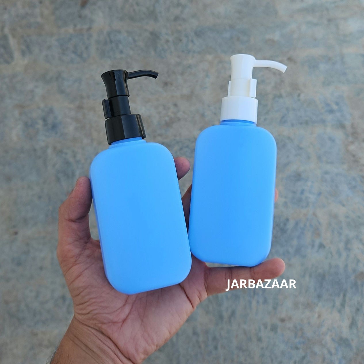 125 ML flat blue HDPE bottle with black and white sleek dispenser pumps