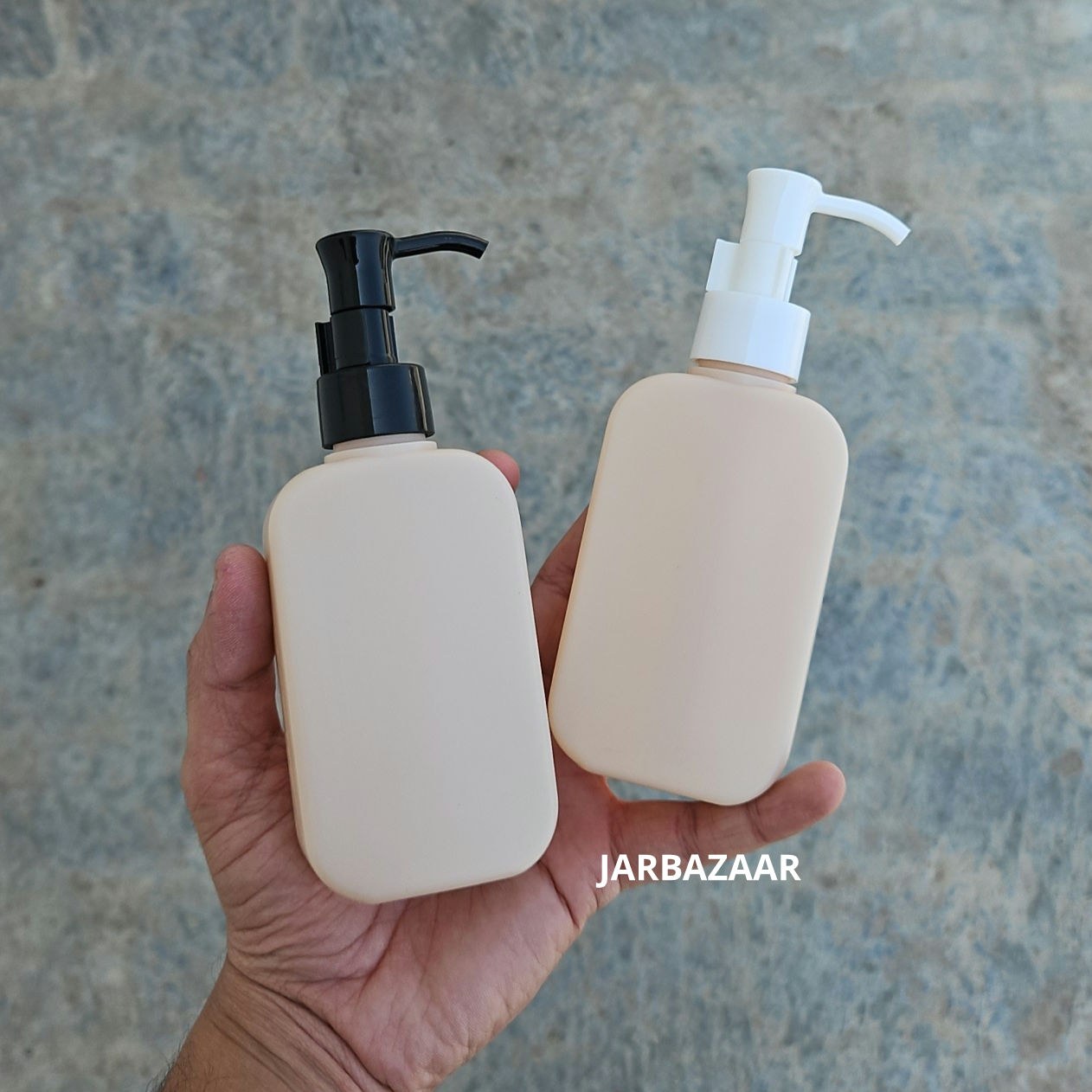125 ML flat cream HDPE bottle with black and white sleek dispenser pumps