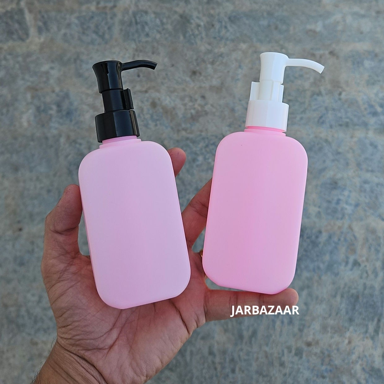 125 ML flat pink HDPE bottle with black and white sleek dispenser pumps