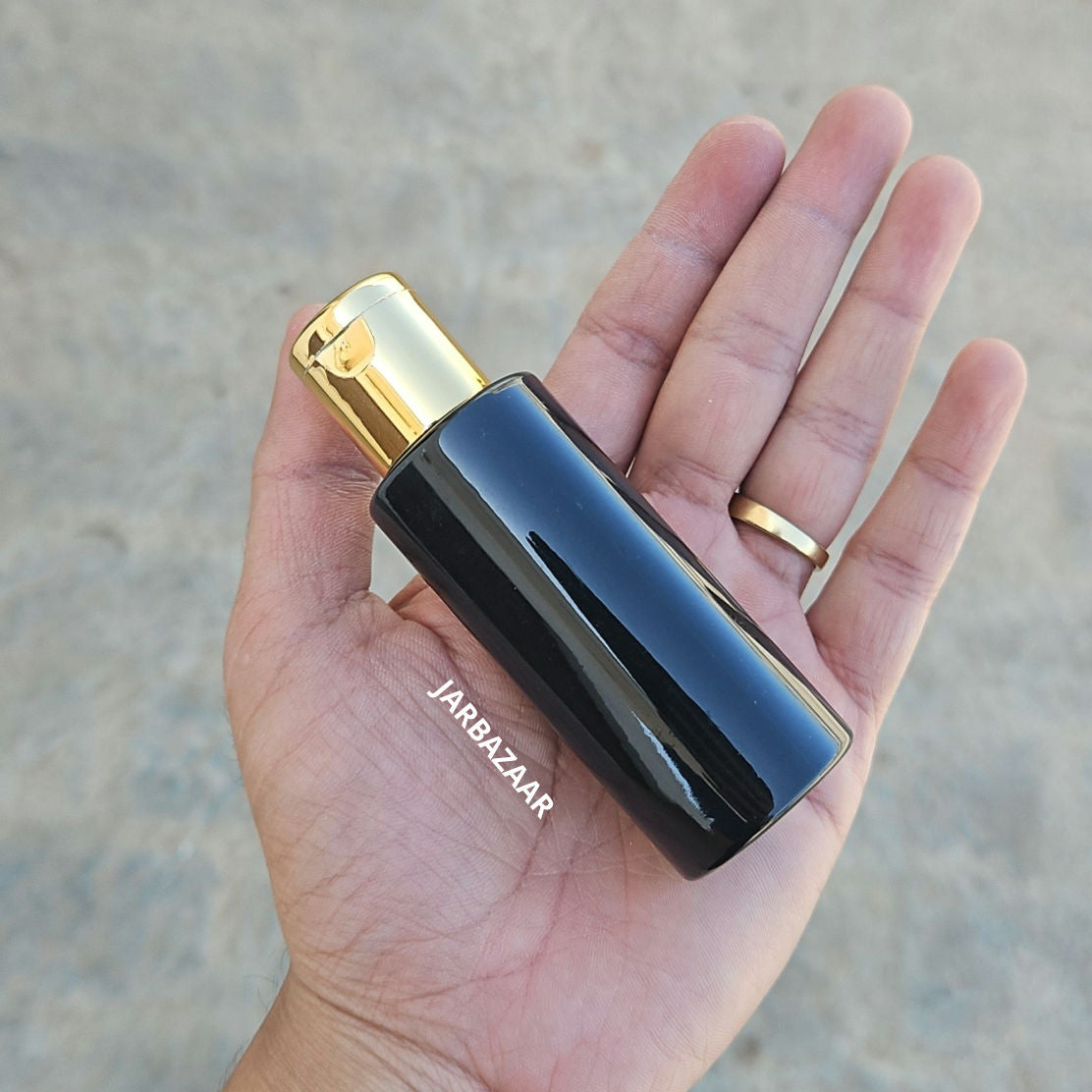 50 ML GLI Black Pet Bottle (With Golden Fliptop Caps)